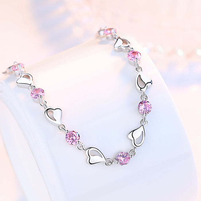 Pulsera chapada en plata con corazón ahuecado para mujer