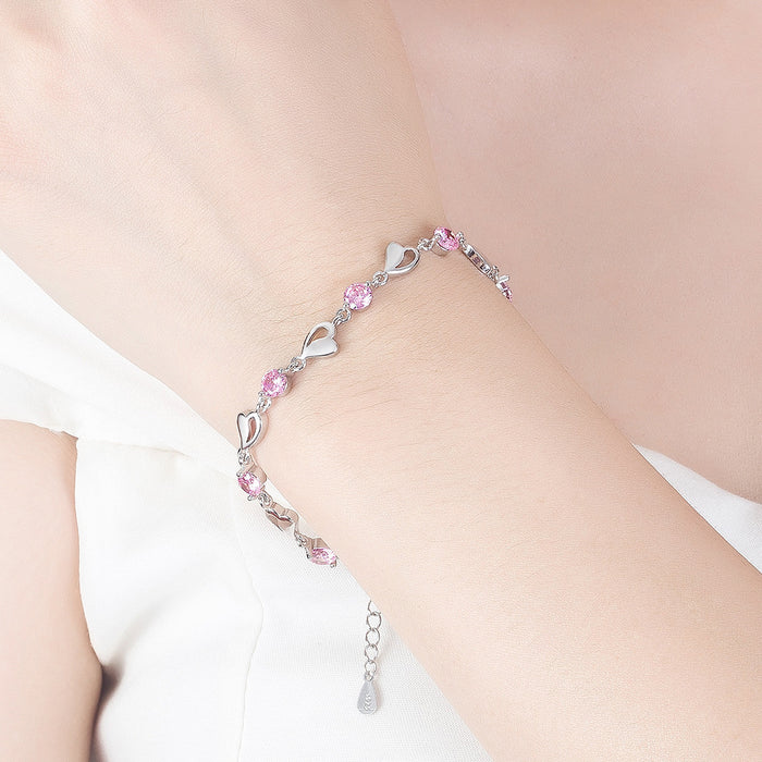 Pulsera chapada en plata con corazón ahuecado para mujer