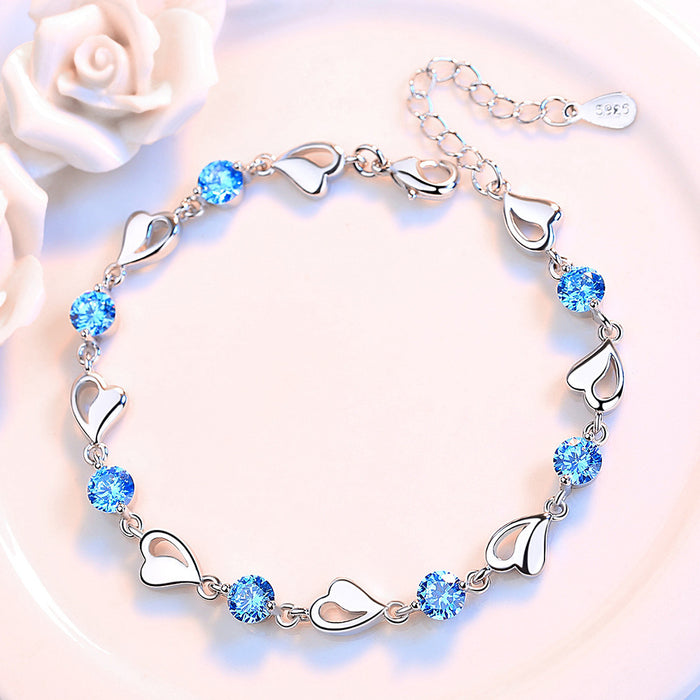 Pulsera chapada en plata con corazón ahuecado para mujer